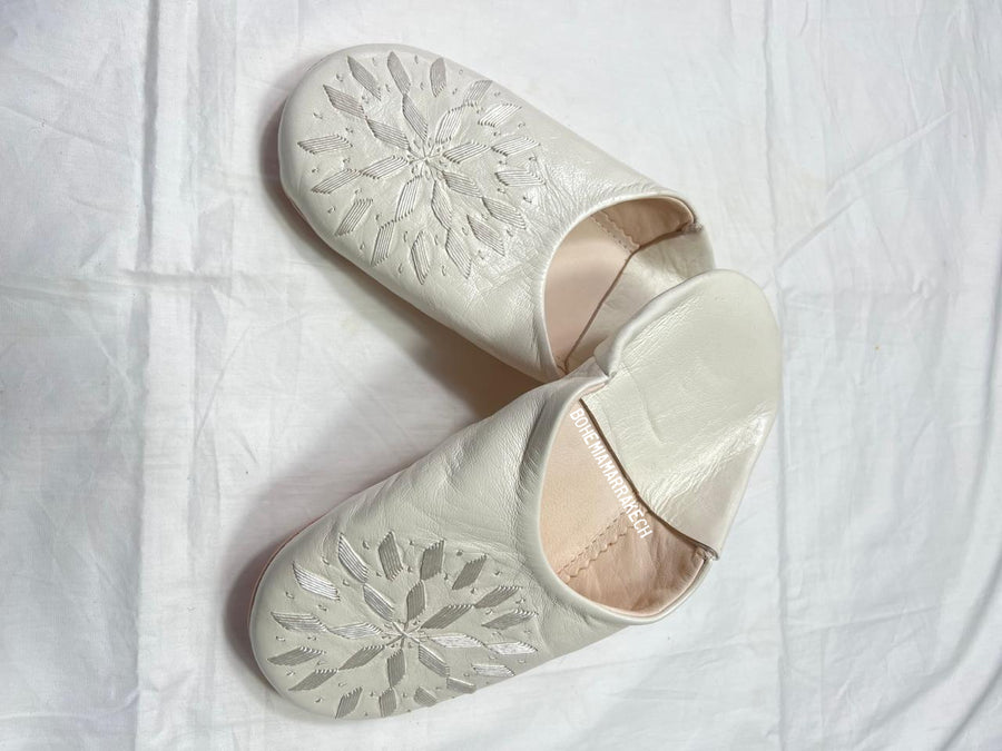 Hand-stitched ivory Moroccan leather babouche slippers with carved geometric design