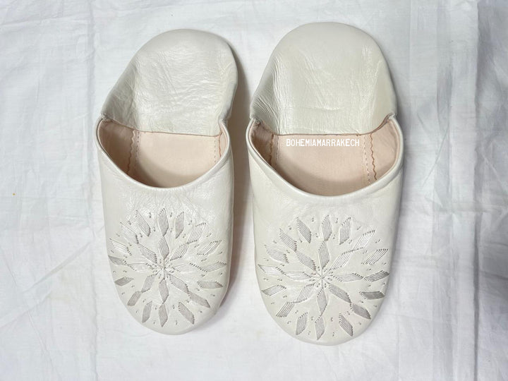 Hand-stitched ivory Moroccan leather babouche slippers with carved geometric design