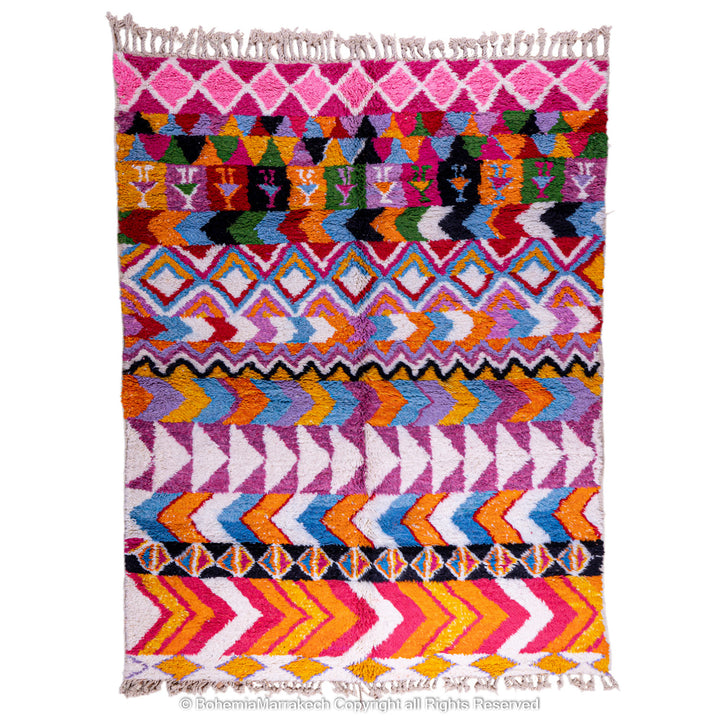 Large colorful Moroccan rug with bold geometric Berber patterns in pink, orange, blue, and yellow