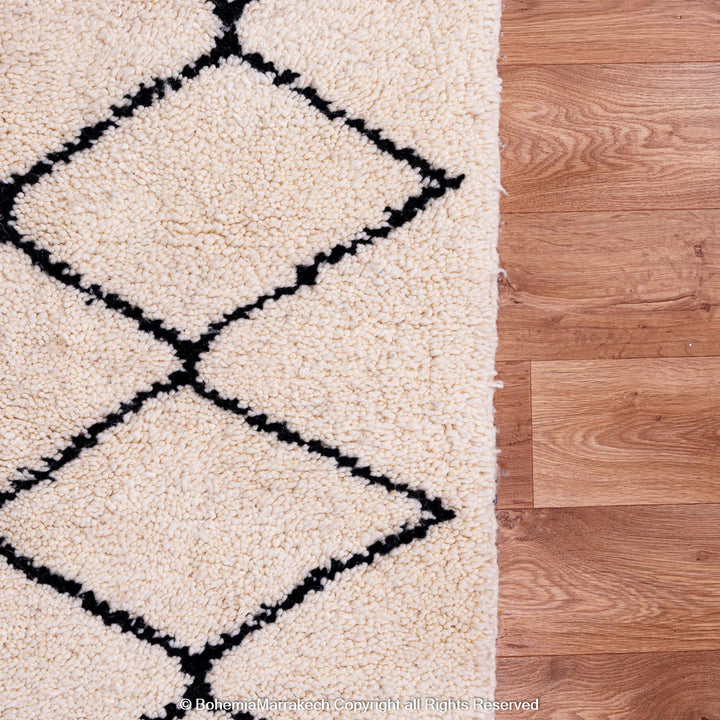 Handwoven Beni Ourain Moroccan rug in black and white wool with geometric diamond pattern