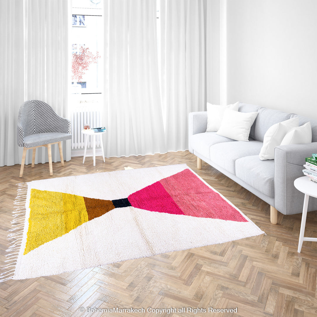 Handmade Moroccan shag rug with yellow and pink abstract hourglass design in Beni Ourain wool style