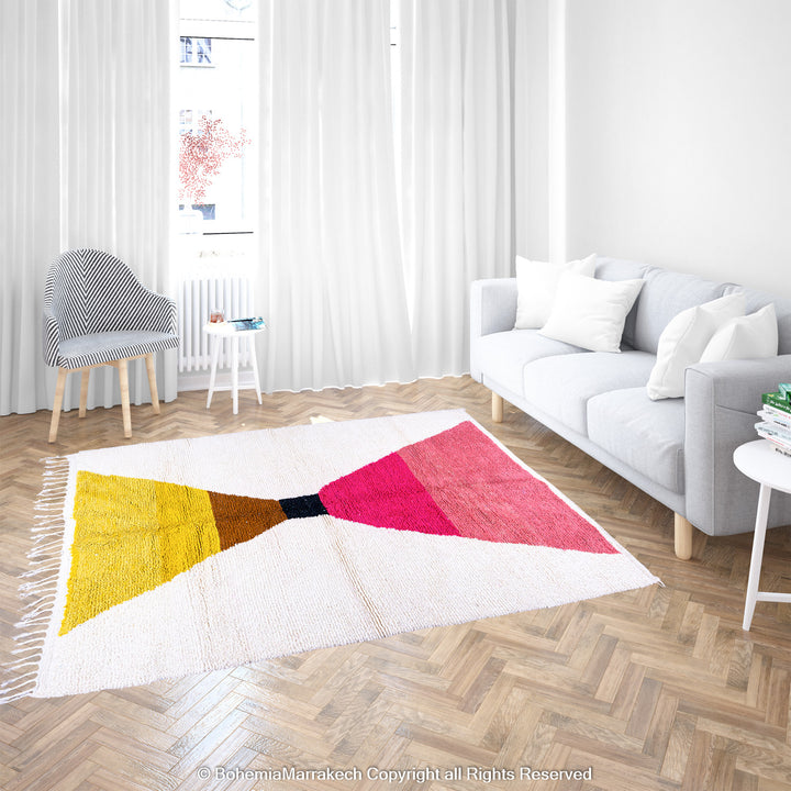 Handmade Moroccan shag rug with yellow and pink abstract hourglass design in Beni Ourain wool style