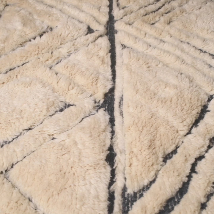Handmade Moroccan Wool Rug with Black Geometric Triangle Pattern