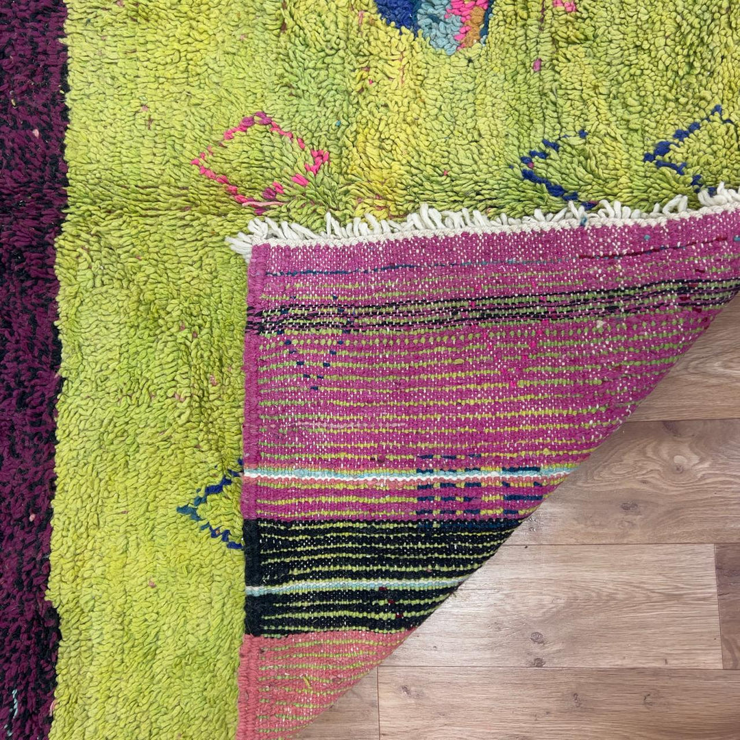small vintage moroccan wool rug with yellow orange green stripes and berber tribal patterns handmade shag rug