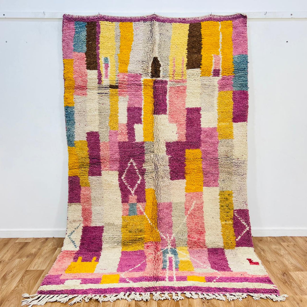 Vintage Moroccan wool rug with colorful geometric Berber design, handmade in Morocco