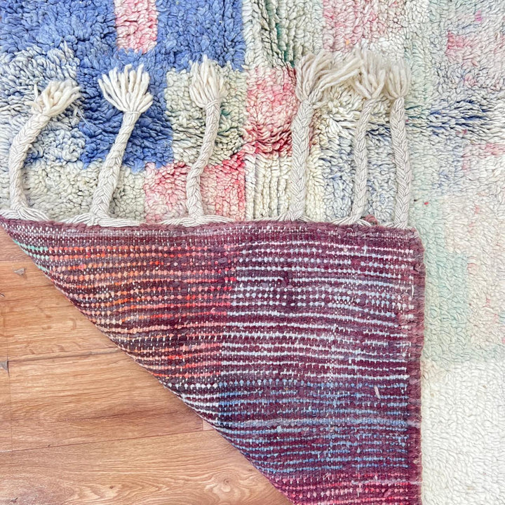 Vintage Moroccan wool rug 789 – handwoven pastel Berber carpet with yellow, pink, cream, and blue tones (241 × 160 cm / 7.9 × 5.25 ft).