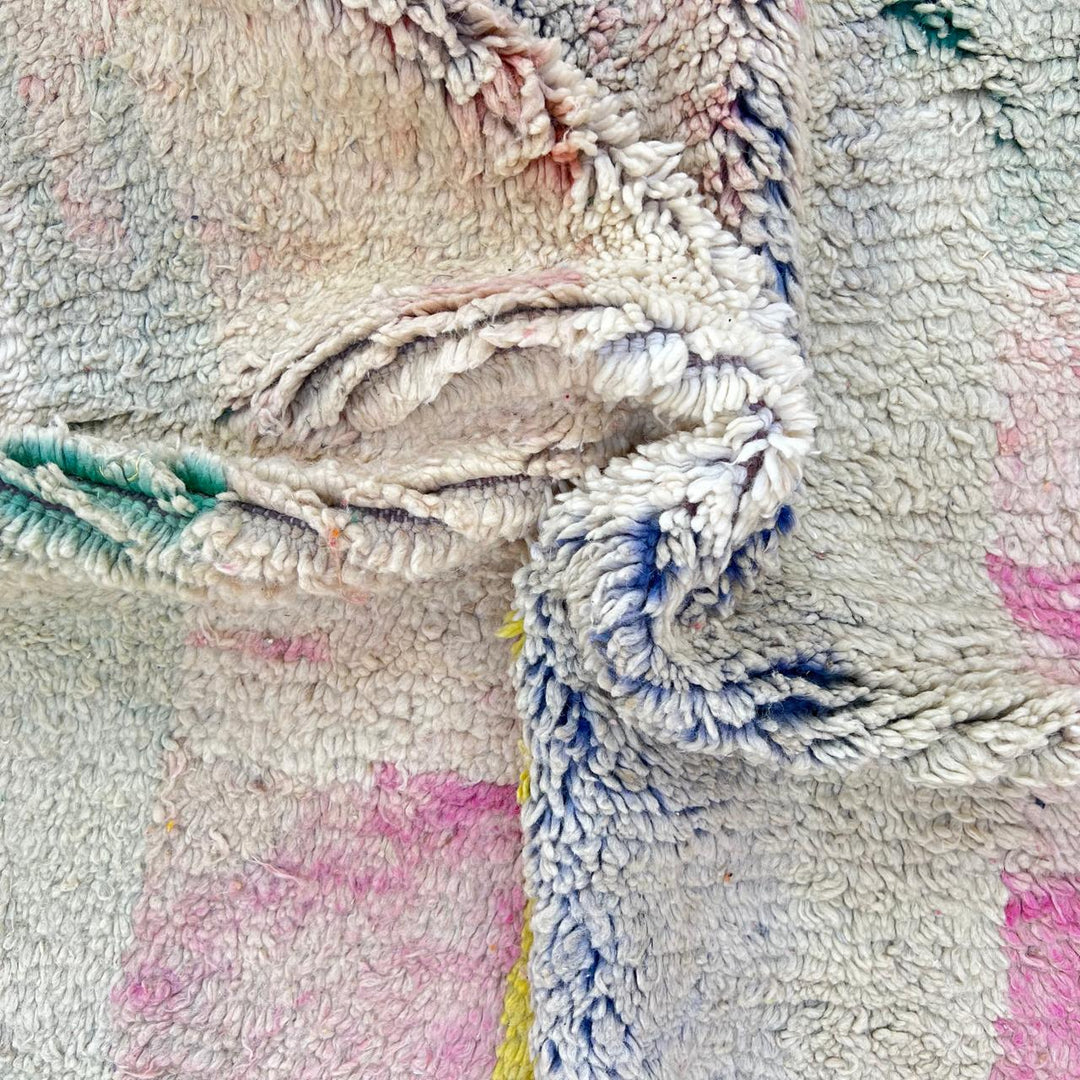 Vintage Moroccan wool rug 789 – handwoven pastel Berber carpet with yellow, pink, cream, and blue tones (241 × 160 cm / 7.9 × 5.25 ft).