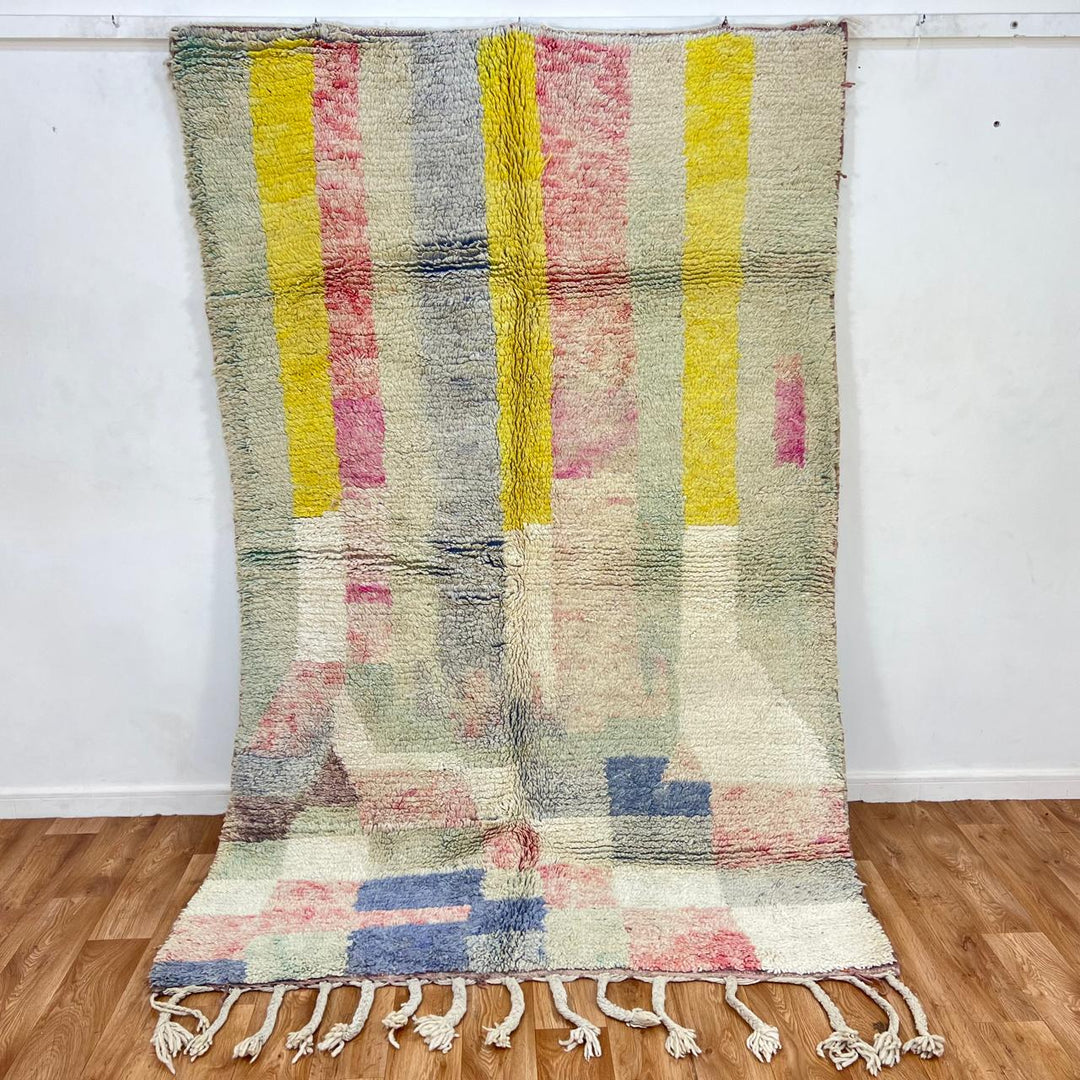 Vintage Moroccan wool rug 789 – handwoven pastel Berber carpet with yellow, pink, cream, and blue tones (241 × 160 cm / 7.9 × 5.25 ft).