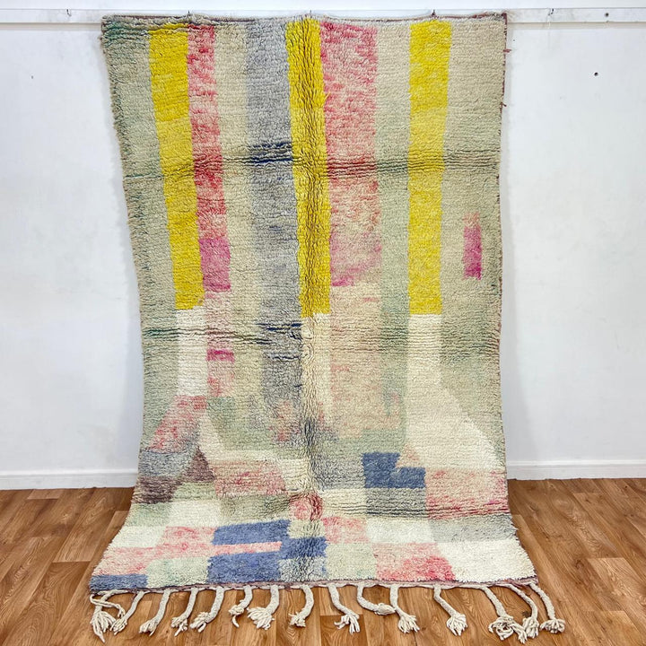 Vintage Moroccan wool rug 789 – handwoven pastel Berber carpet with yellow, pink, cream, and blue tones (241 × 160 cm / 7.9 × 5.25 ft).