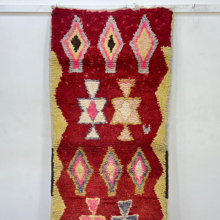 Vintage Moroccan wool rug 820 – red Berber runner with yellow borders and geometric diamond motifs (290 × 84 cm / 9.51 × 2.75 ft).