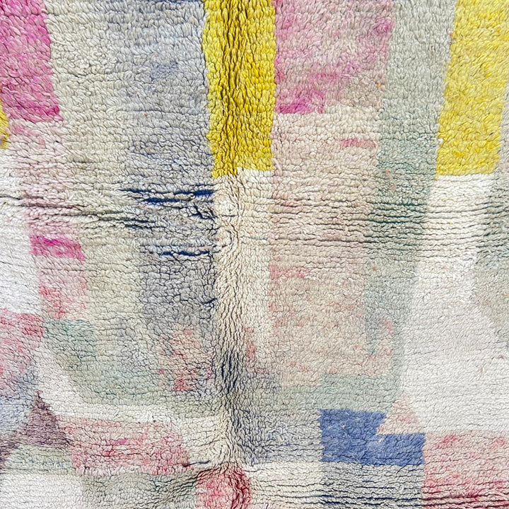 Vintage Moroccan wool rug 789 – handwoven pastel Berber carpet with yellow, pink, cream, and blue tones (241 × 160 cm / 7.9 × 5.25 ft).