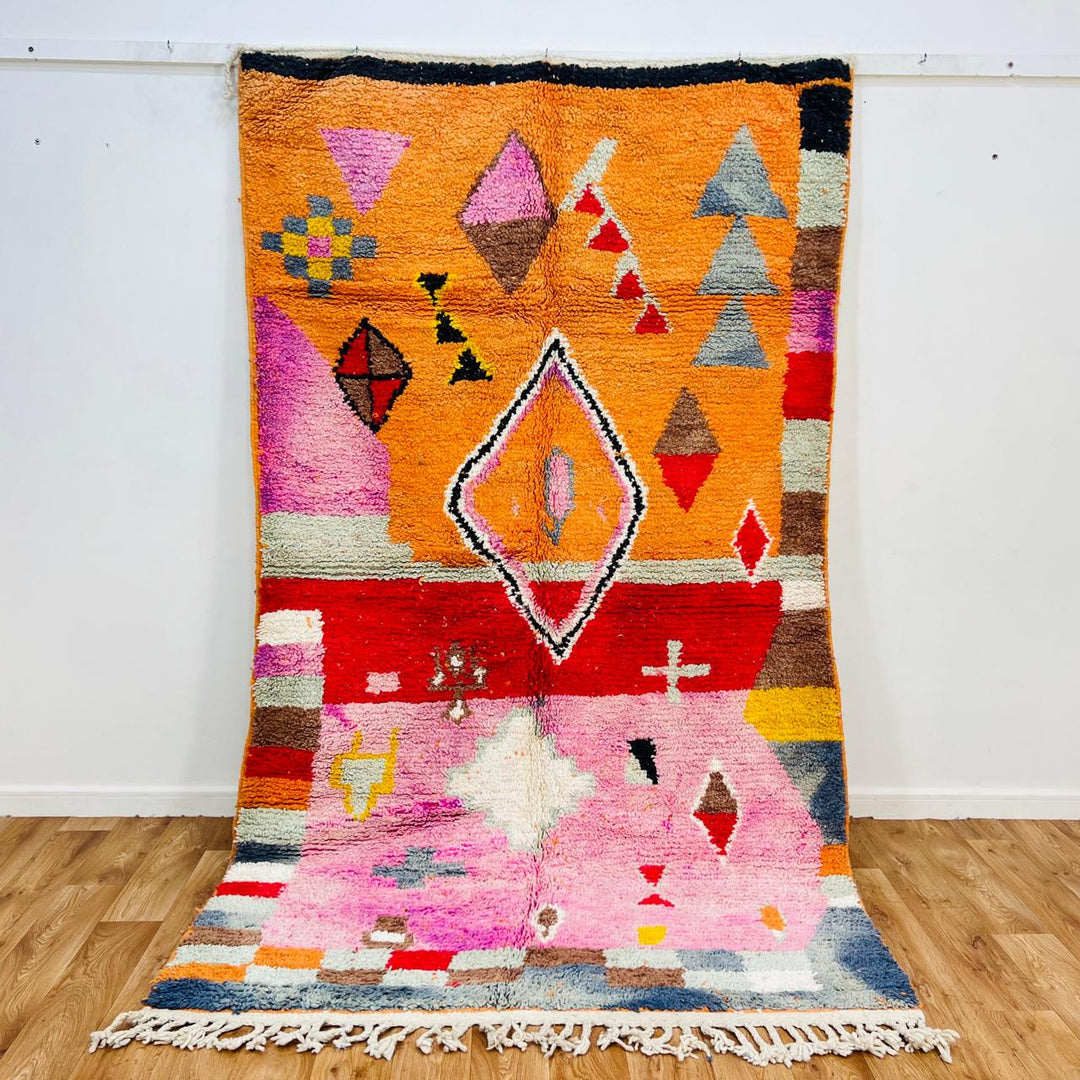 Vintage Moroccan rug handmade from colorful Berber wool with geometric tribal design