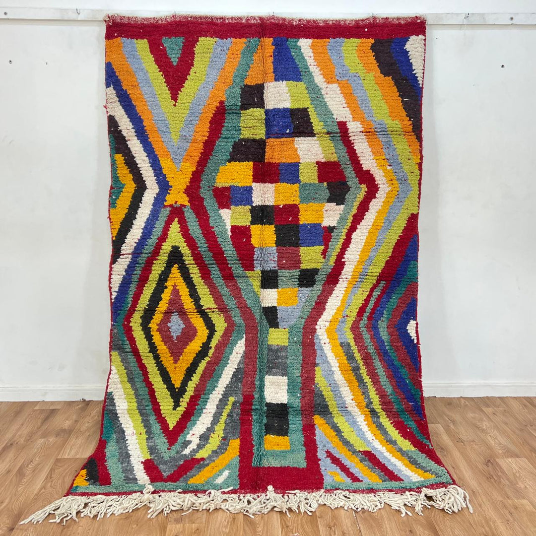 Vintage Moroccan wool rug with colorful chevron and geometric Berber pattern in red, mustard, green and ivory