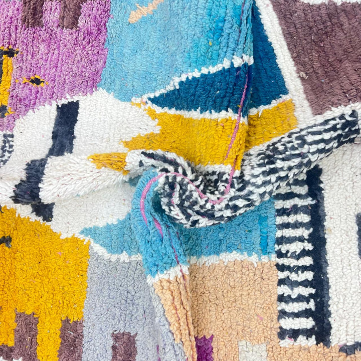 Vintage Moroccan wool rug with abstract Berber geometric motifs in mustard yellow, blue, lilac and ivory, handwoven in Morocco