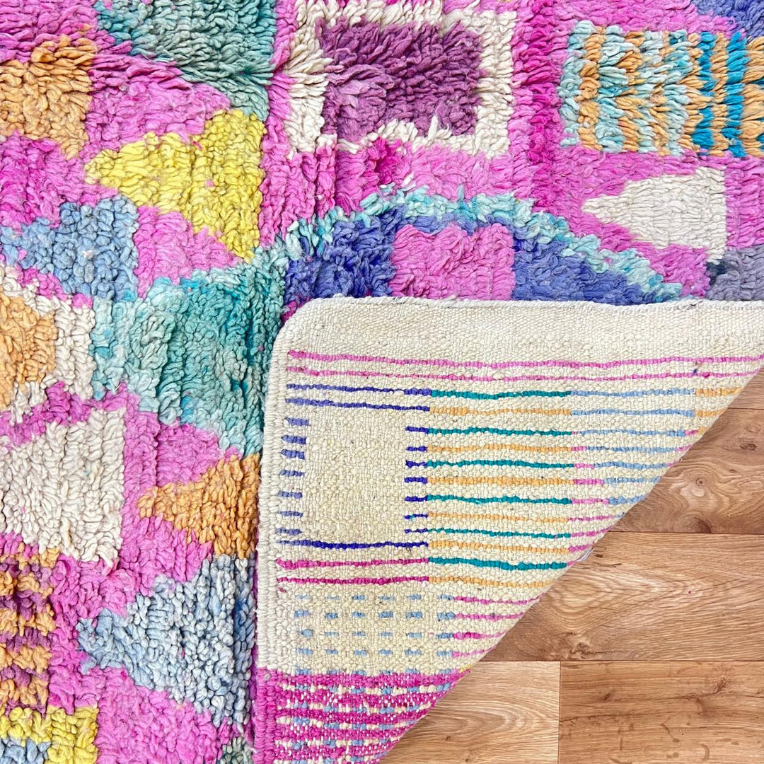 Vintage Moroccan wool rug 810 – colorful handmade Berber carpet with geometric diamond patterns in pink, mustard, green, and turquoise, 255 × 166 cm (8.36 × 5.44 ft).