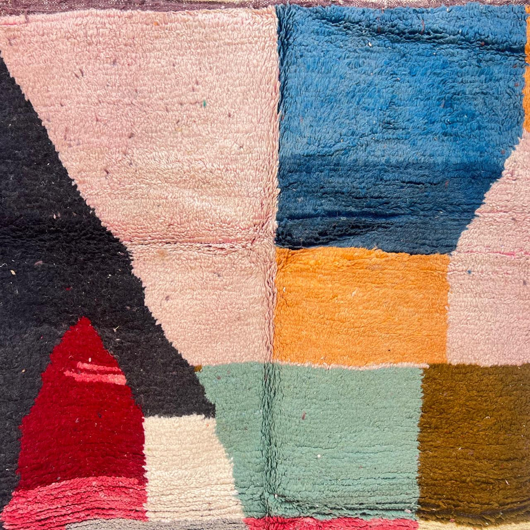 Vintage Moroccan Wool Rug BM168 – handmade geometric color block Moroccan rug in red, blue, and mustard tones (250 × 143 cm).