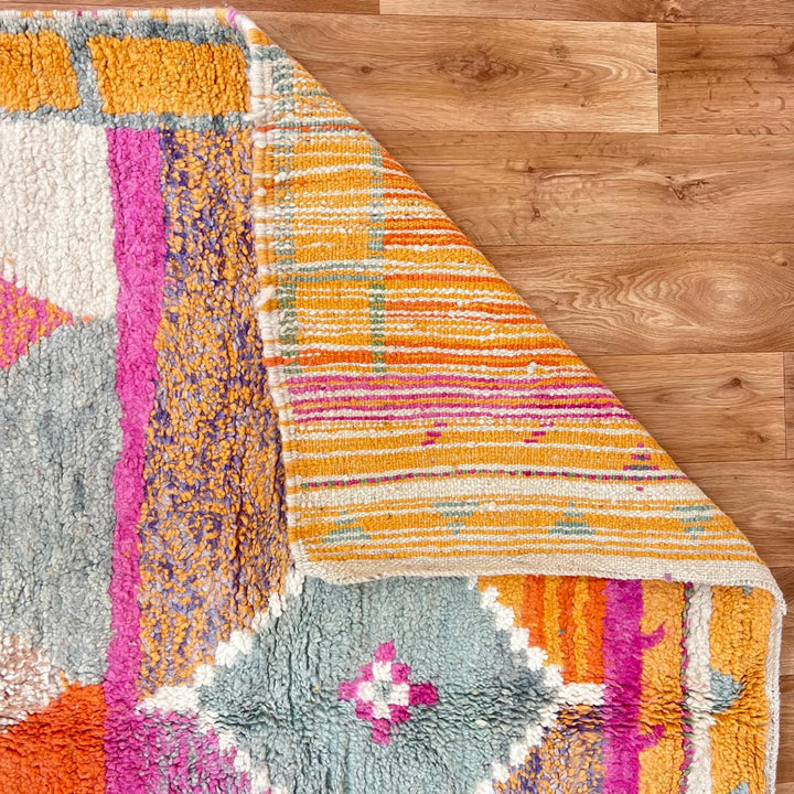 Vintage Moroccan Wool Rug 196 – handmade colorful orange, pink, and grey Berber wool rug (262 × 161 cm).