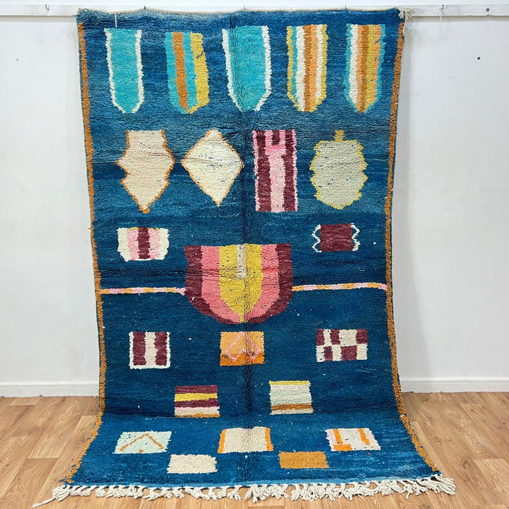 Vintage Moroccan wool rug 263 – handmade blue geometric Berber design with mustard and ivory accents (253 × 157 cm).