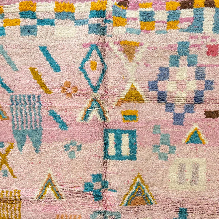 Vintage Moroccan wool rug 202 – handmade Berber rug with pastel pink, yellow, and blue geometric patterns (236 × 160 cm).