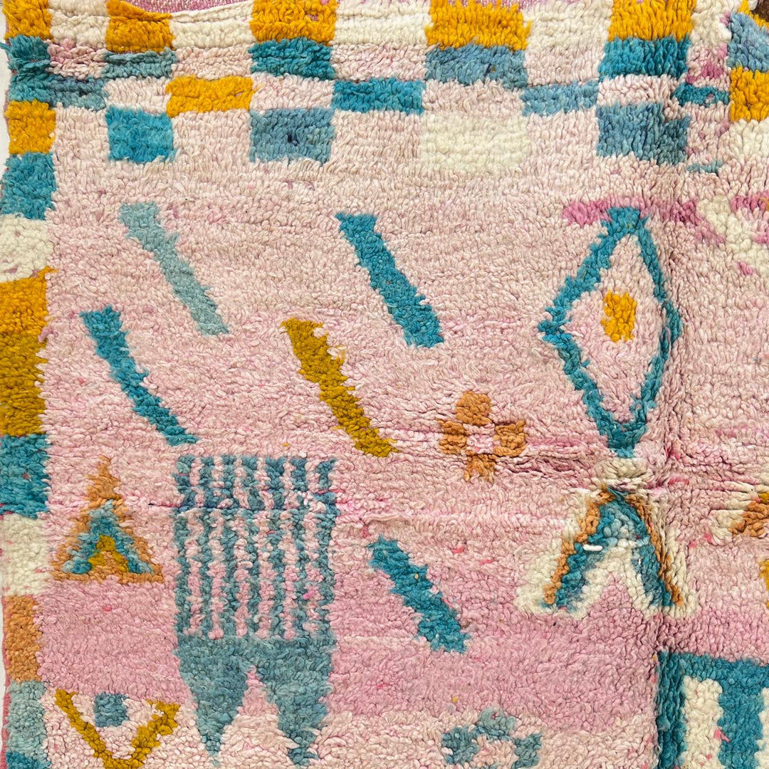 Vintage Moroccan wool rug 202 – handmade Berber rug with pastel pink, yellow, and blue geometric patterns (236 × 160 cm).