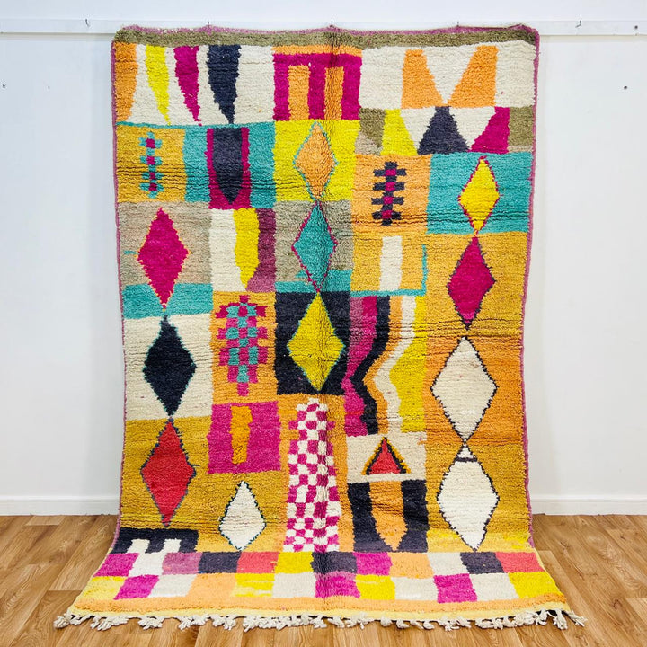 Vintage Moroccan wool rug with colorful Berber geometric grid pattern in yellow, pink, turquoise and ivory, handmade in Morocco, 251x164 cm