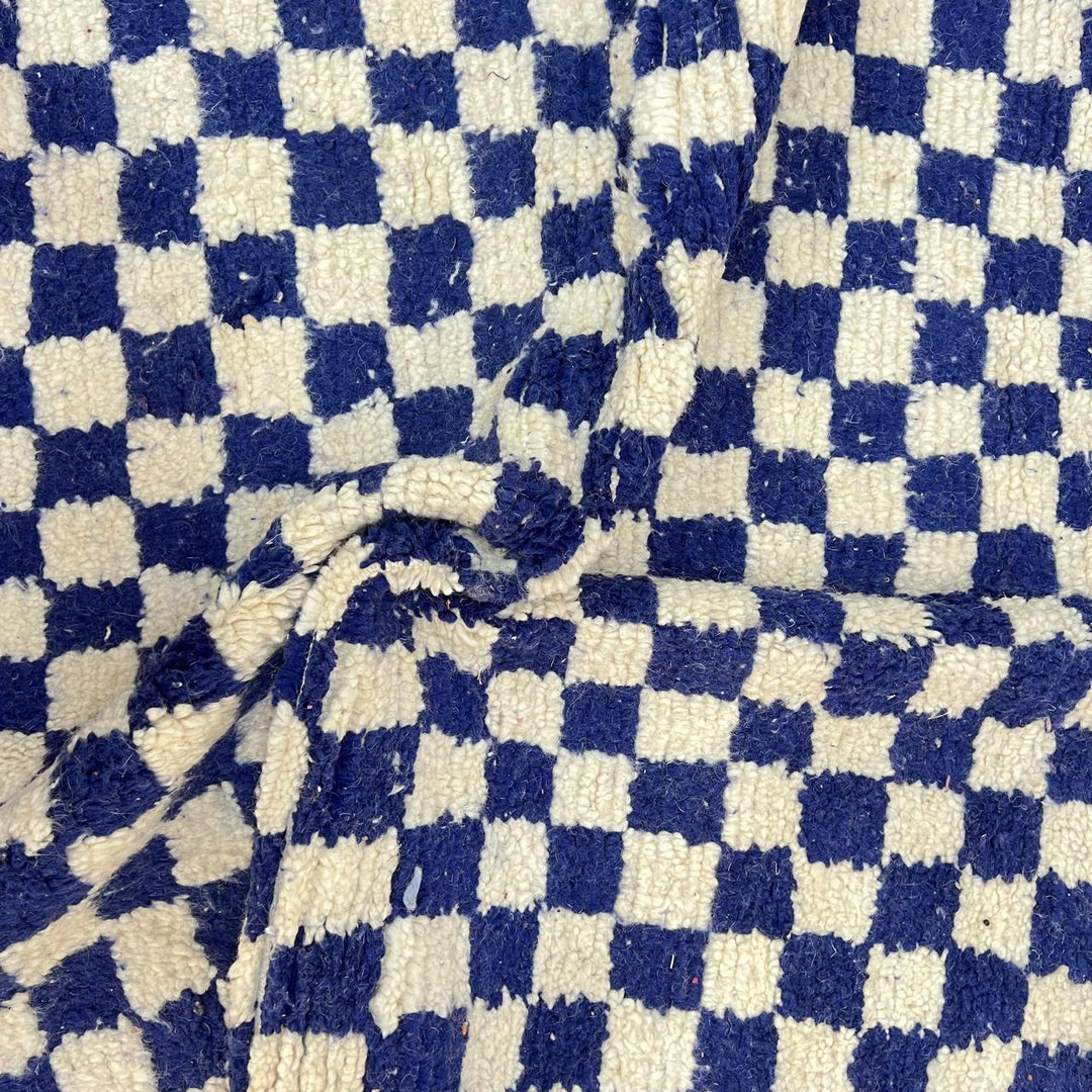 Vintage Moroccan wool rug 142 – handmade blue and white checkered Berber rug (243 × 152 cm).