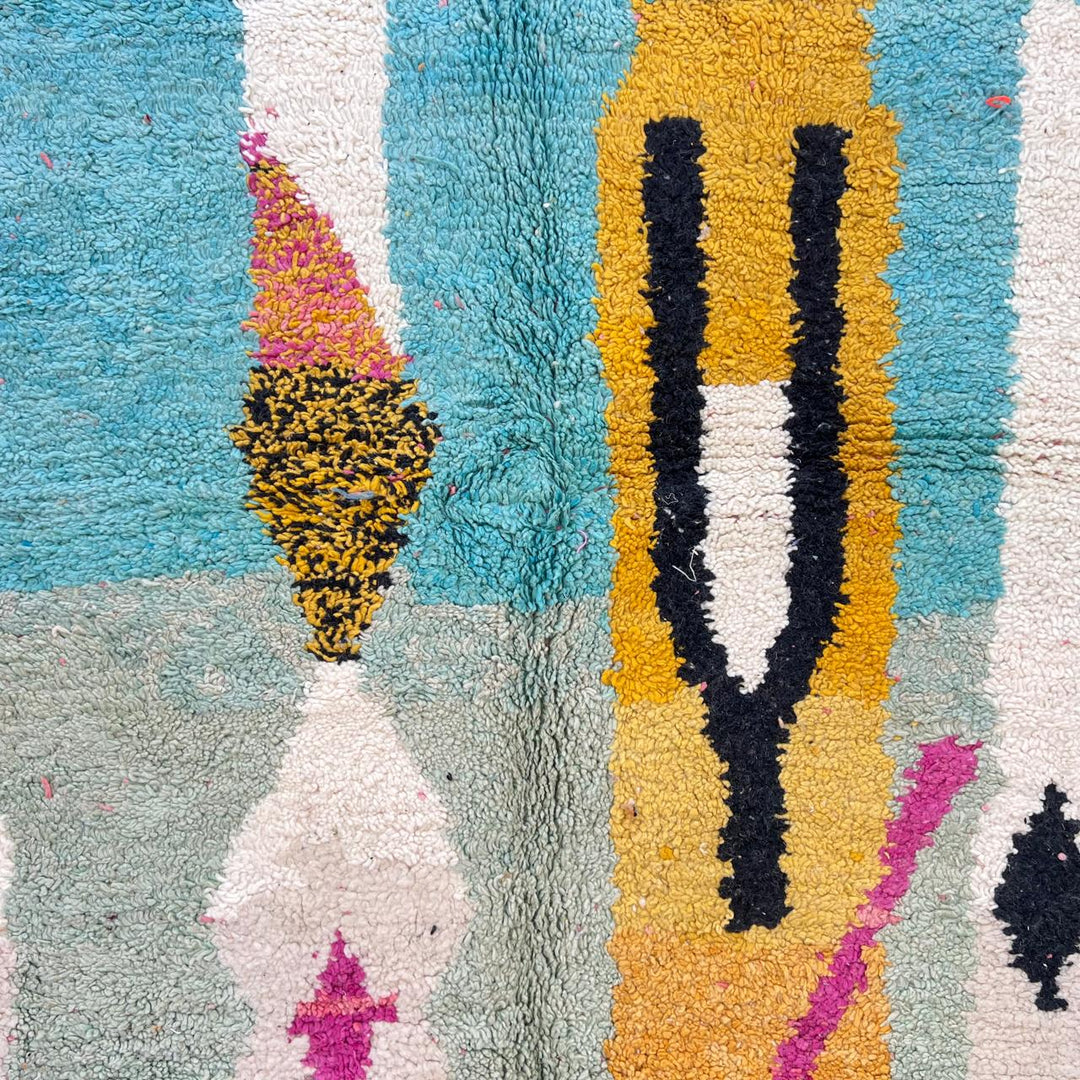 Vintage Moroccan wool rug 857 – handmade abstract Berber carpet in turquoise, black, pink, and mustard tones (290 × 205 cm / 9.51 × 6.72 ft).