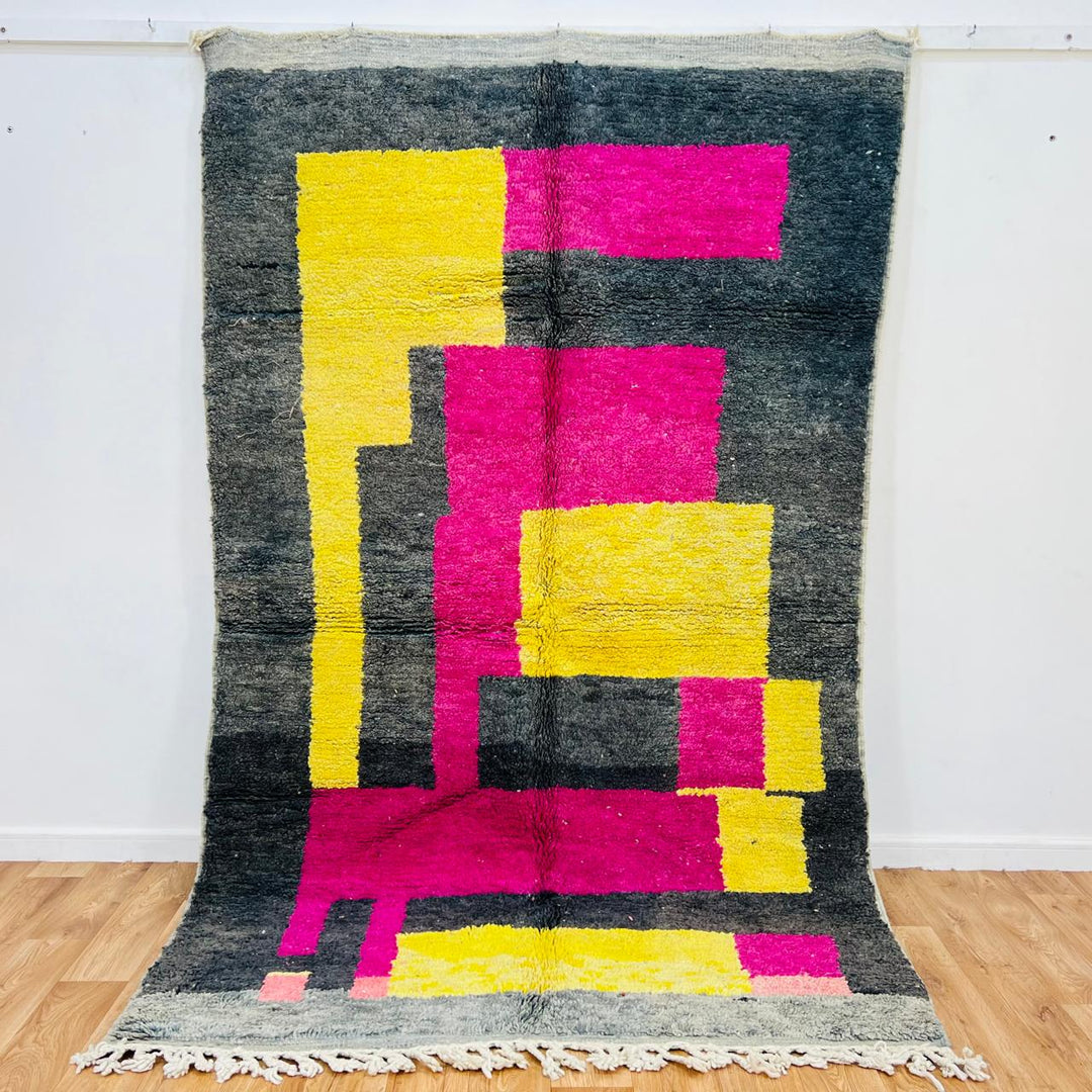 Vintage Moroccan wool rug with pink yellow and charcoal geometric pattern, handwoven Berber carpet from Morocco
