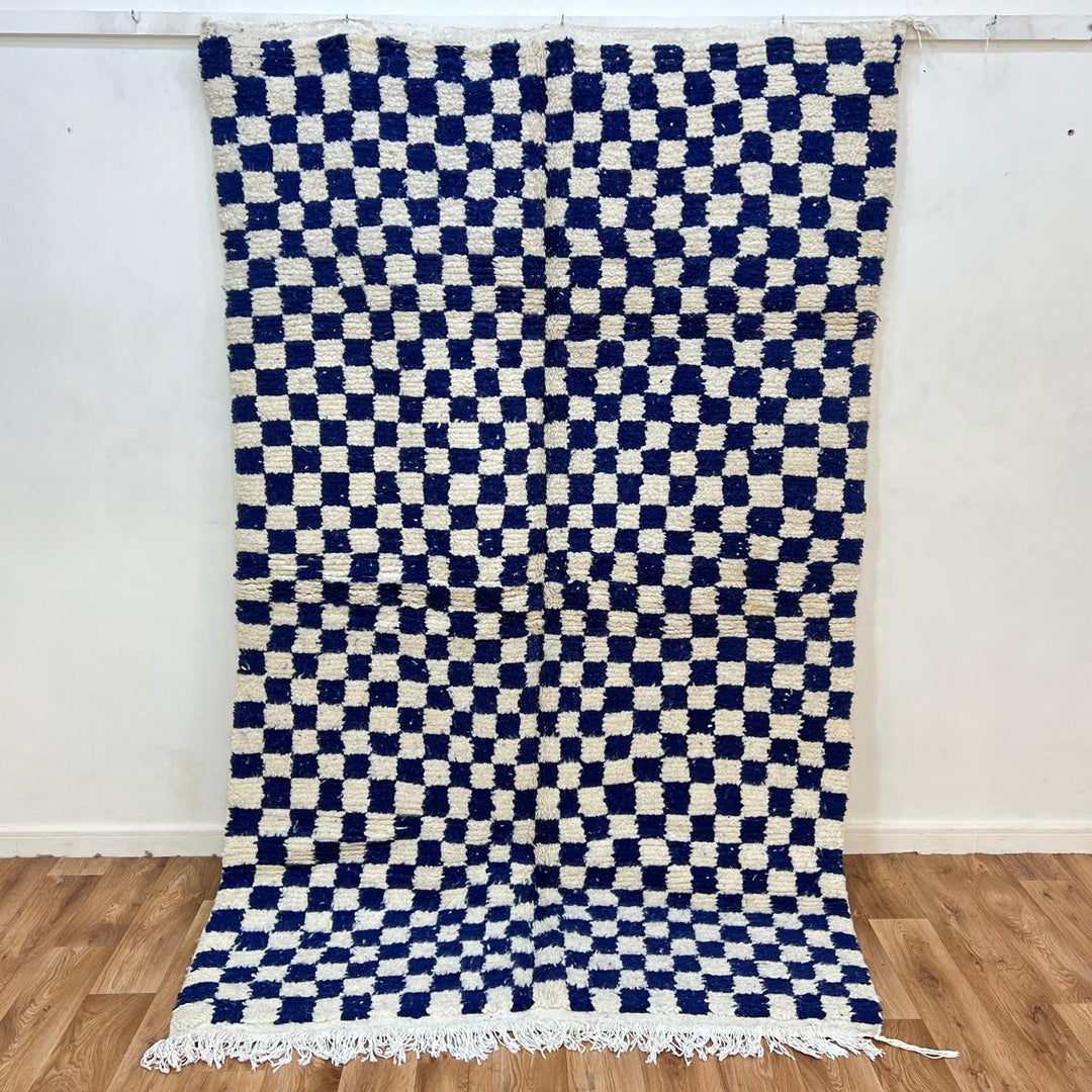 Vintage Moroccan wool rug 142 – handmade blue and white checkered Berber rug (243 × 152 cm).