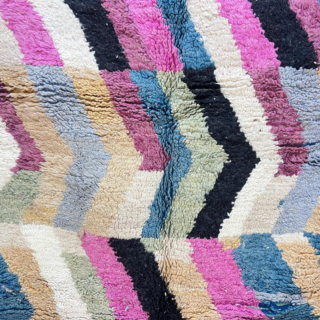 Vintage Moroccan wool rug 773 – colorful handmade Berber carpet with zigzag chevron patterns in blue, pink, yellow, and cream, 264 × 164 cm (8.66 × 5.38 ft).