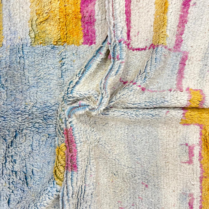 Vintage Moroccan wool rug 207 – handmade minimal abstract design in cream, pink and yellow (263 × 154 cm).