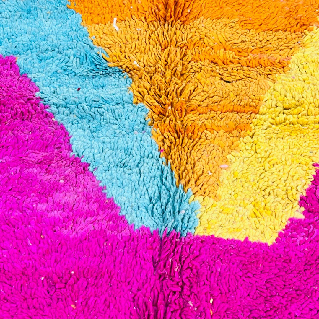 Vintage Moroccan wool rug with pink base, turquoise, orange and yellow abstract Berber design, handmade in Morocco, size 255x156 cm