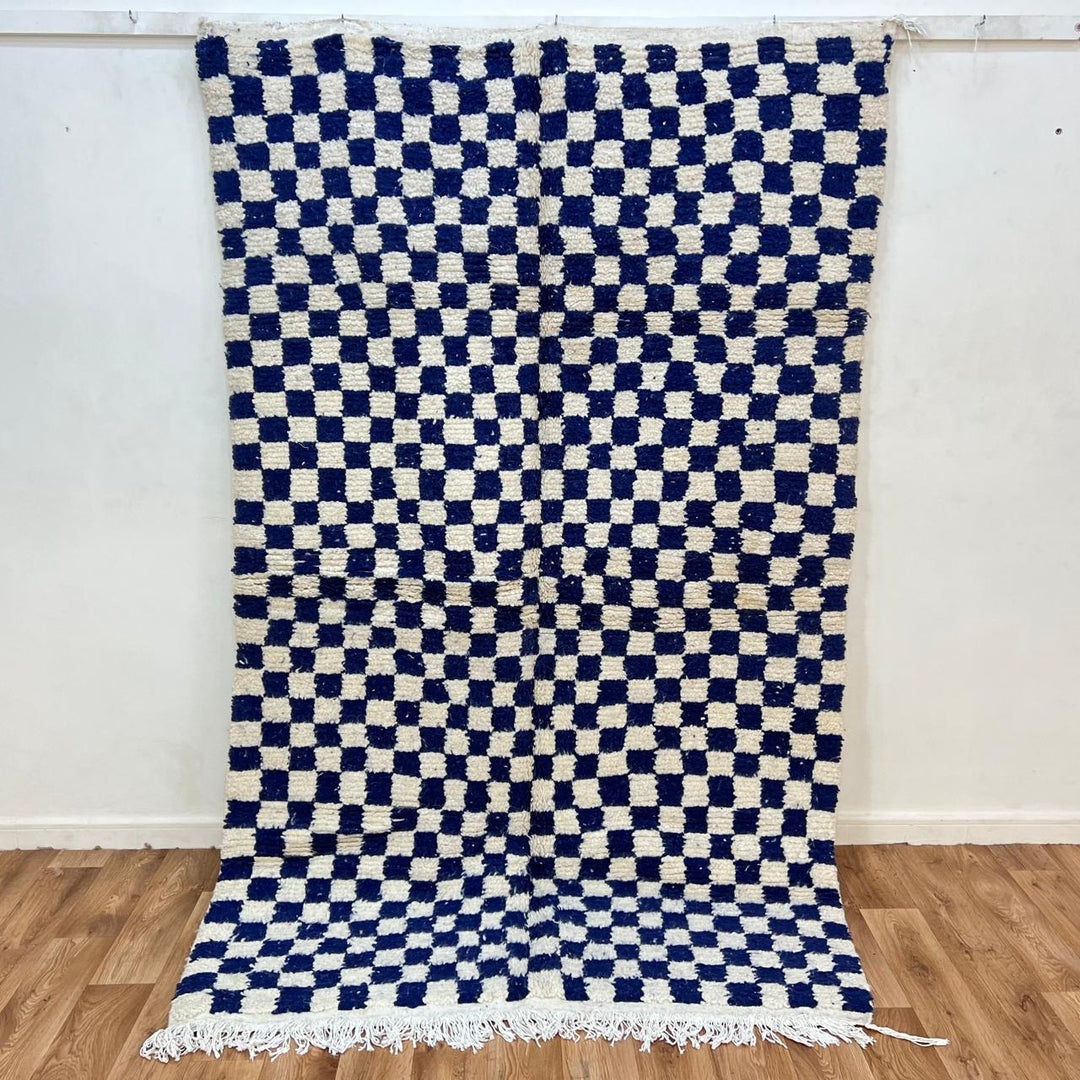 Vintage Moroccan wool rug 142 – handmade blue and white checkered Berber rug (243 × 152 cm).