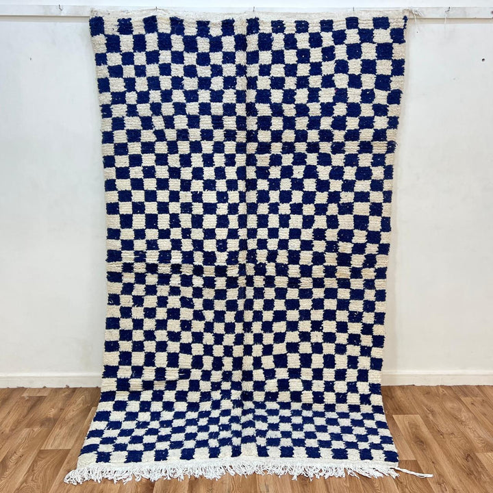 Vintage Moroccan wool rug 142 – handmade blue and white checkered Berber rug (243 × 152 cm).