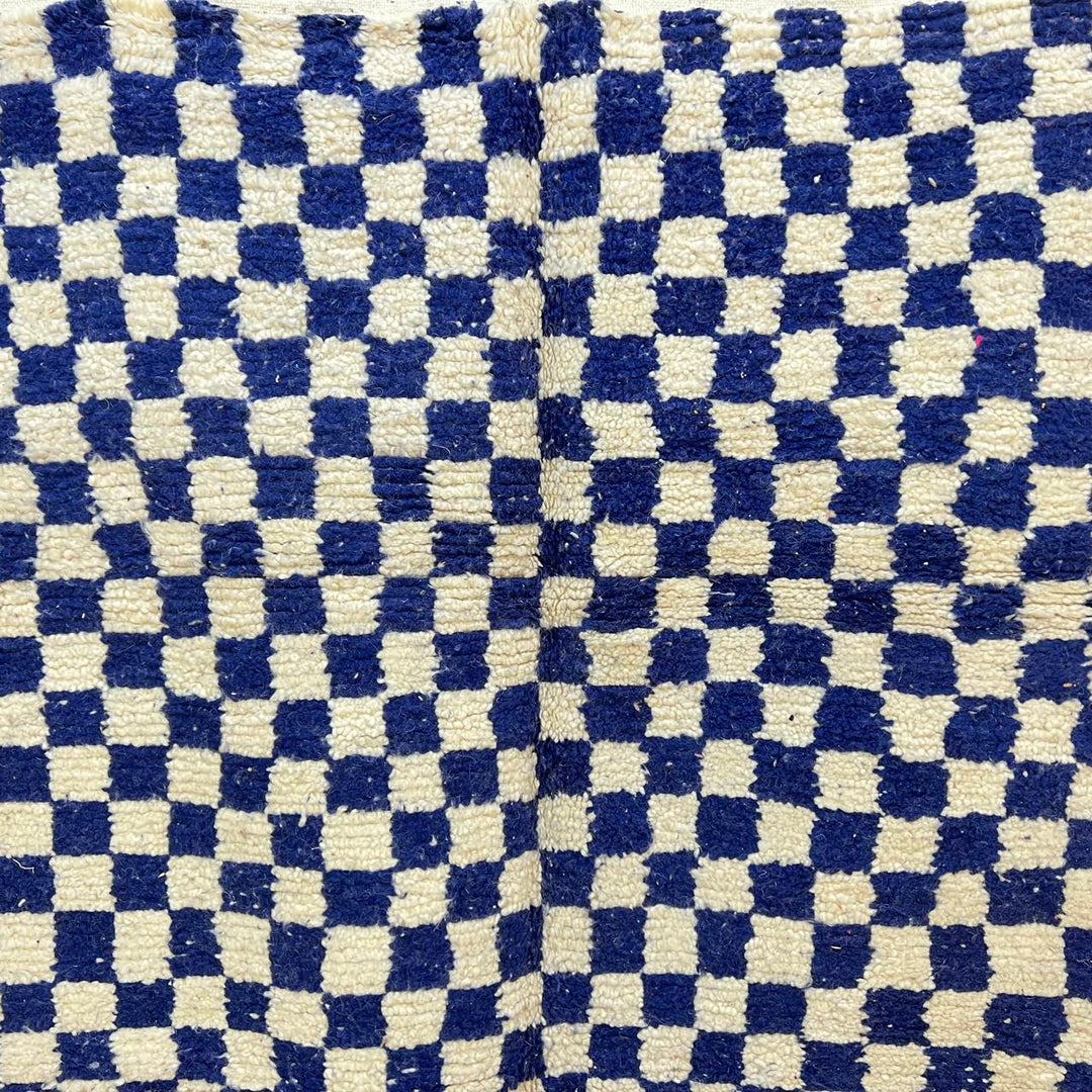 Vintage Moroccan wool rug 142 – handmade blue and white checkered Berber rug (243 × 152 cm).