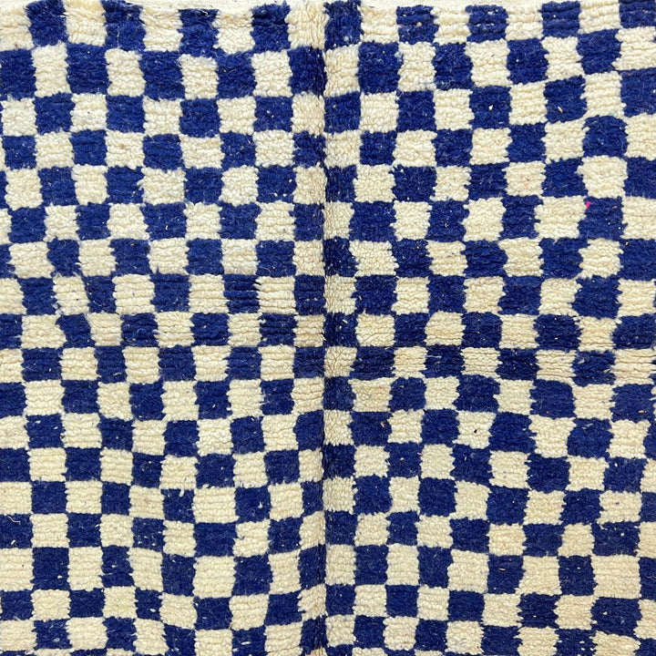 Vintage Moroccan wool rug 142 – handmade blue and white checkered Berber rug (243 × 152 cm).