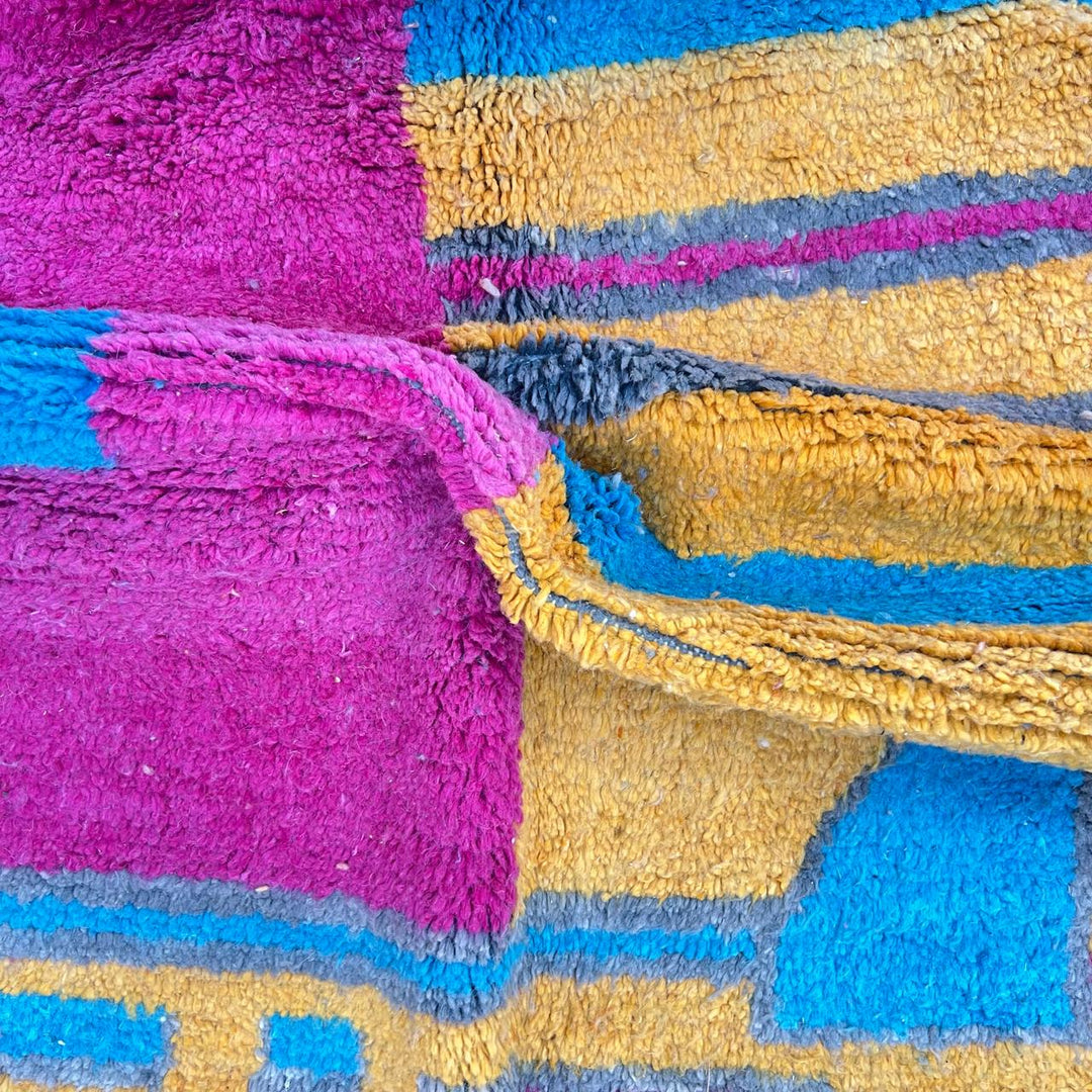 Vintage Moroccan wool rug 193 – handmade colorful abstract Moroccan wool rug in pink, yellow, and blue (250 × 165 cm).