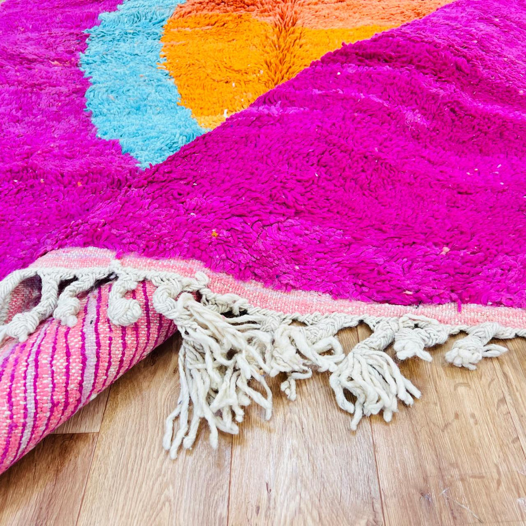 Vintage Moroccan wool rug with pink base, turquoise, orange and yellow abstract Berber design, handmade in Morocco, size 255x156 cm