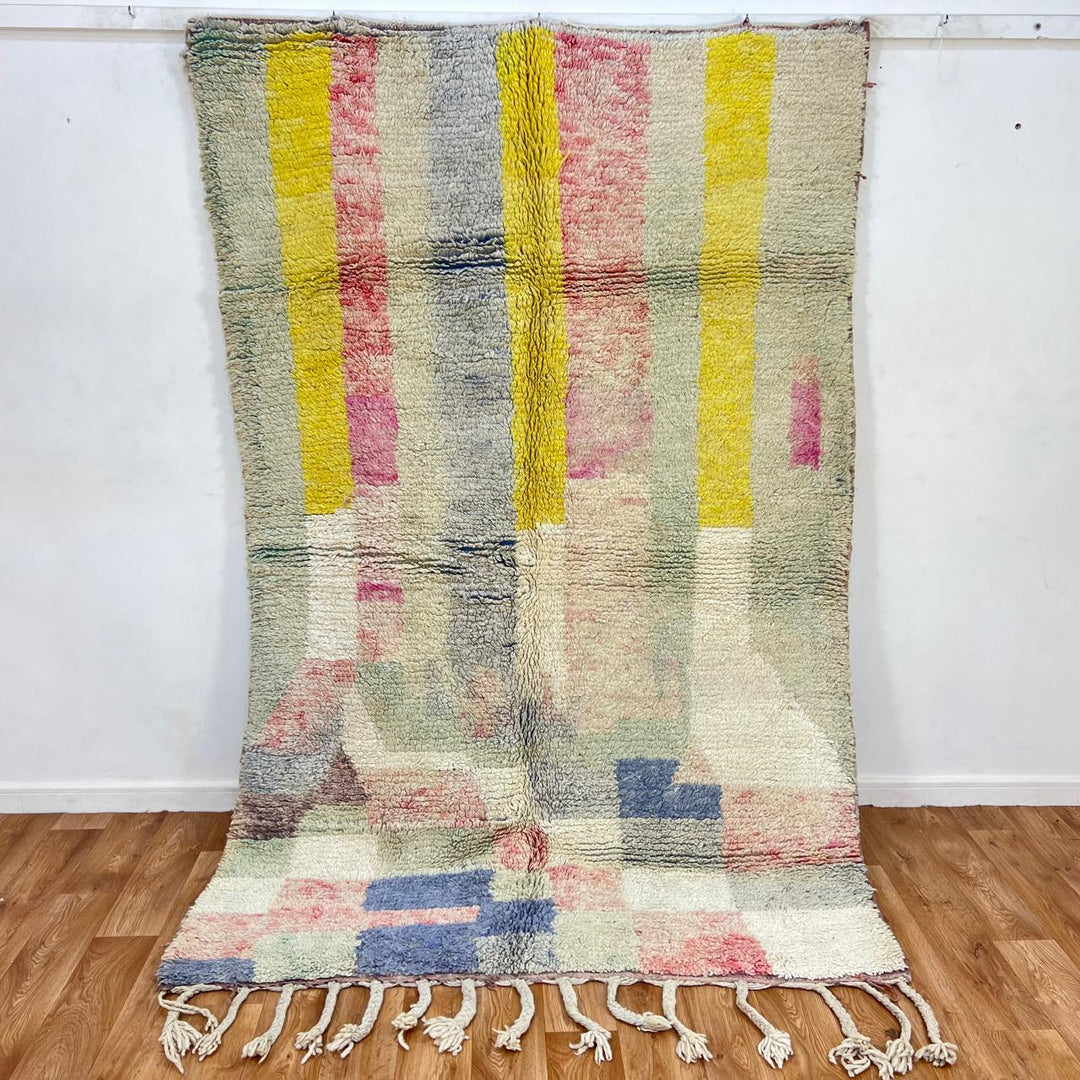Vintage Moroccan wool rug 789 – handwoven pastel Berber carpet with yellow, pink, cream, and blue tones (241 × 160 cm / 7.9 × 5.25 ft).