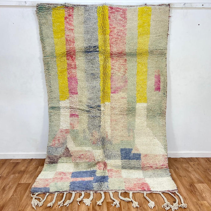 Vintage Moroccan wool rug 789 – handwoven pastel Berber carpet with yellow, pink, cream, and blue tones (241 × 160 cm / 7.9 × 5.25 ft).