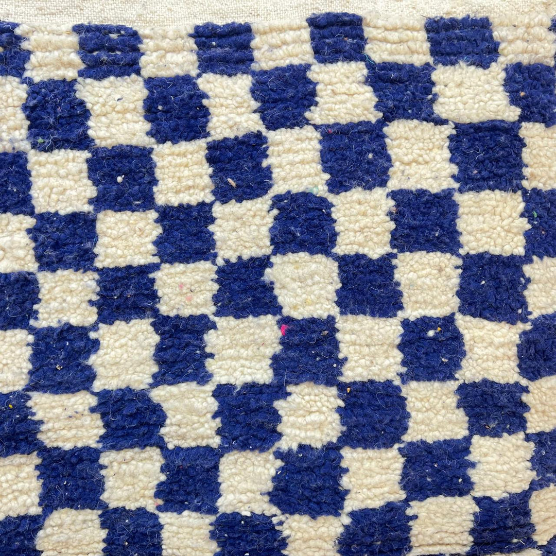Vintage Moroccan wool rug 142 – handmade blue and white checkered Berber rug (243 × 152 cm).