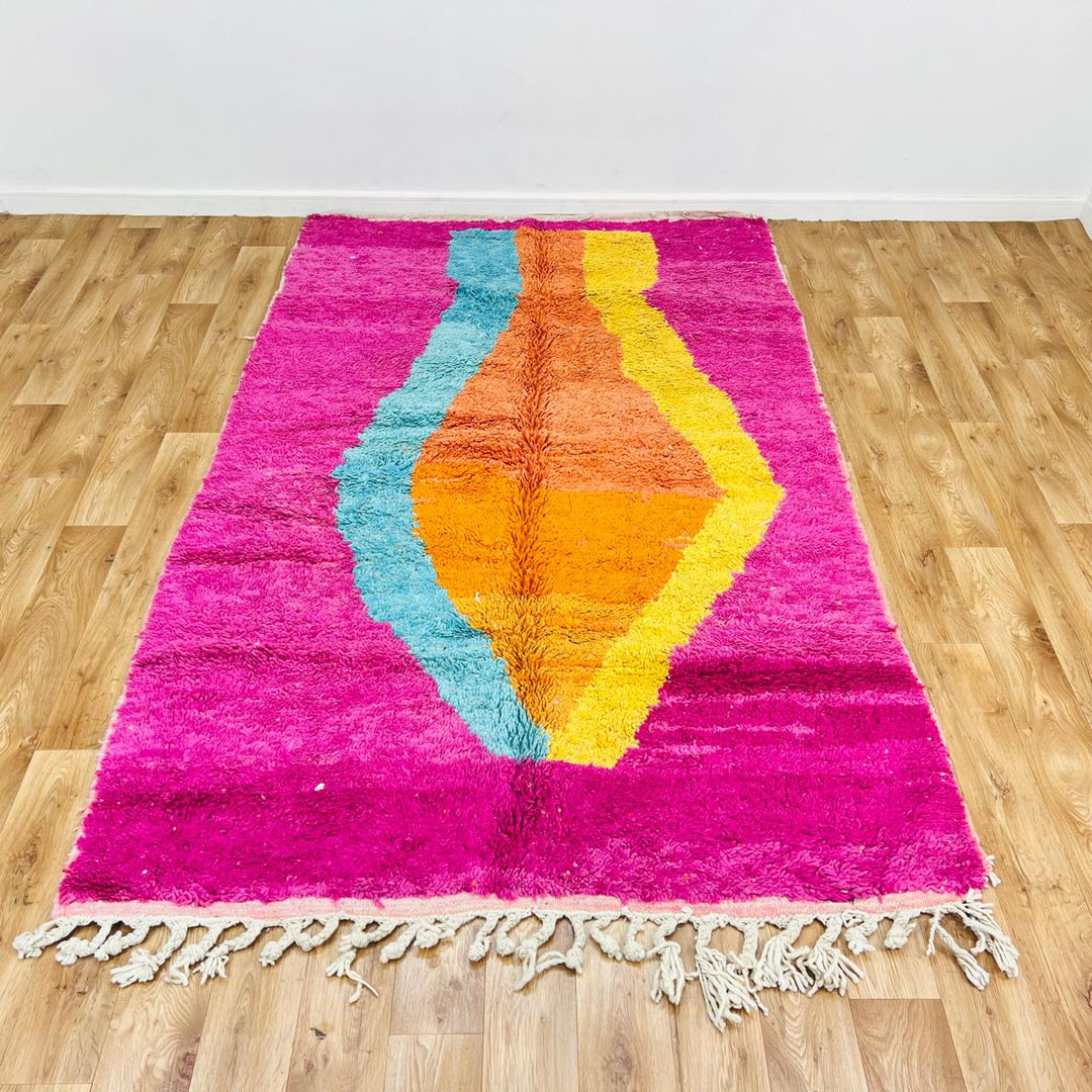 Vintage Moroccan wool rug with pink base, turquoise, orange and yellow abstract Berber design, handmade in Morocco, size 255x156 cm