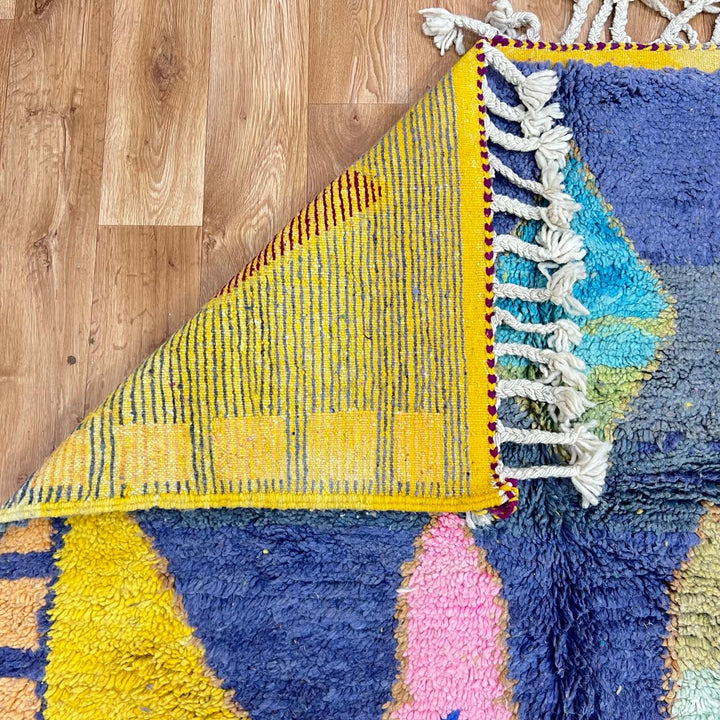 Vintage Moroccan wool rug 158 – handmade geometric colorful pattern in blue, purple, and mustard tones (264 × 147 cm).