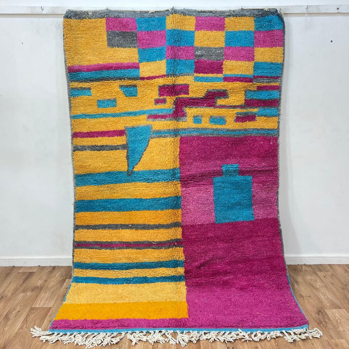 Vintage Moroccan wool rug 193 – handmade colorful abstract Moroccan wool rug in pink, yellow, and blue (250 × 165 cm).