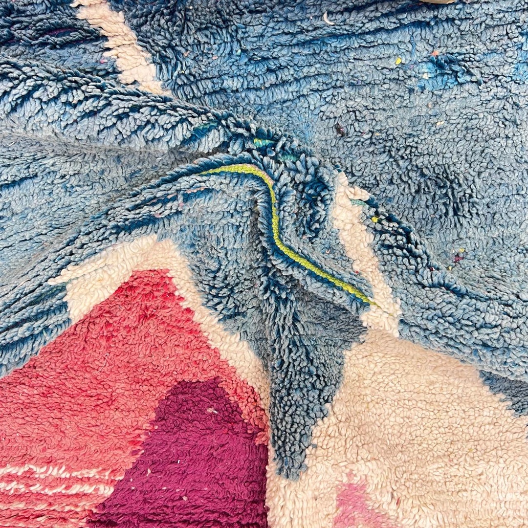 Vintage Moroccan wool rug BM31 – handmade blue, pink, and yellow abstract geometric design (253 × 148 cm).