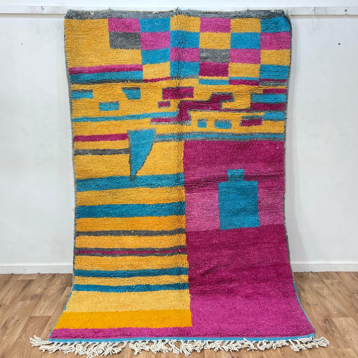 Vintage Moroccan wool rug 193 – handmade colorful abstract Moroccan wool rug in pink, yellow, and blue (250 × 165 cm).
