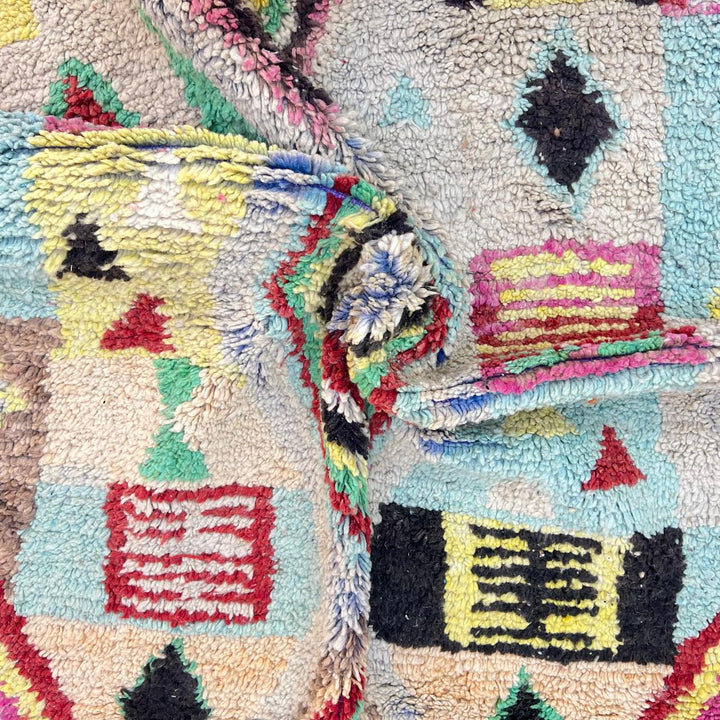 Vintage Moroccan wool rug 137 – handmade colorful geometric Berber design in turquoise, red, and yellow tones (256 × 156 cm).