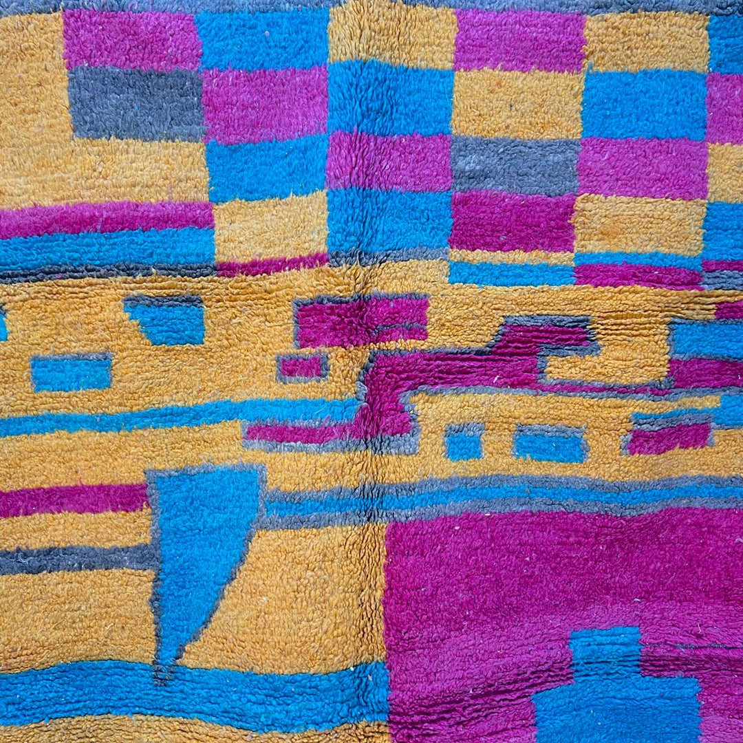 Vintage Moroccan wool rug 193 – handmade colorful abstract Moroccan wool rug in pink, yellow, and blue (250 × 165 cm).