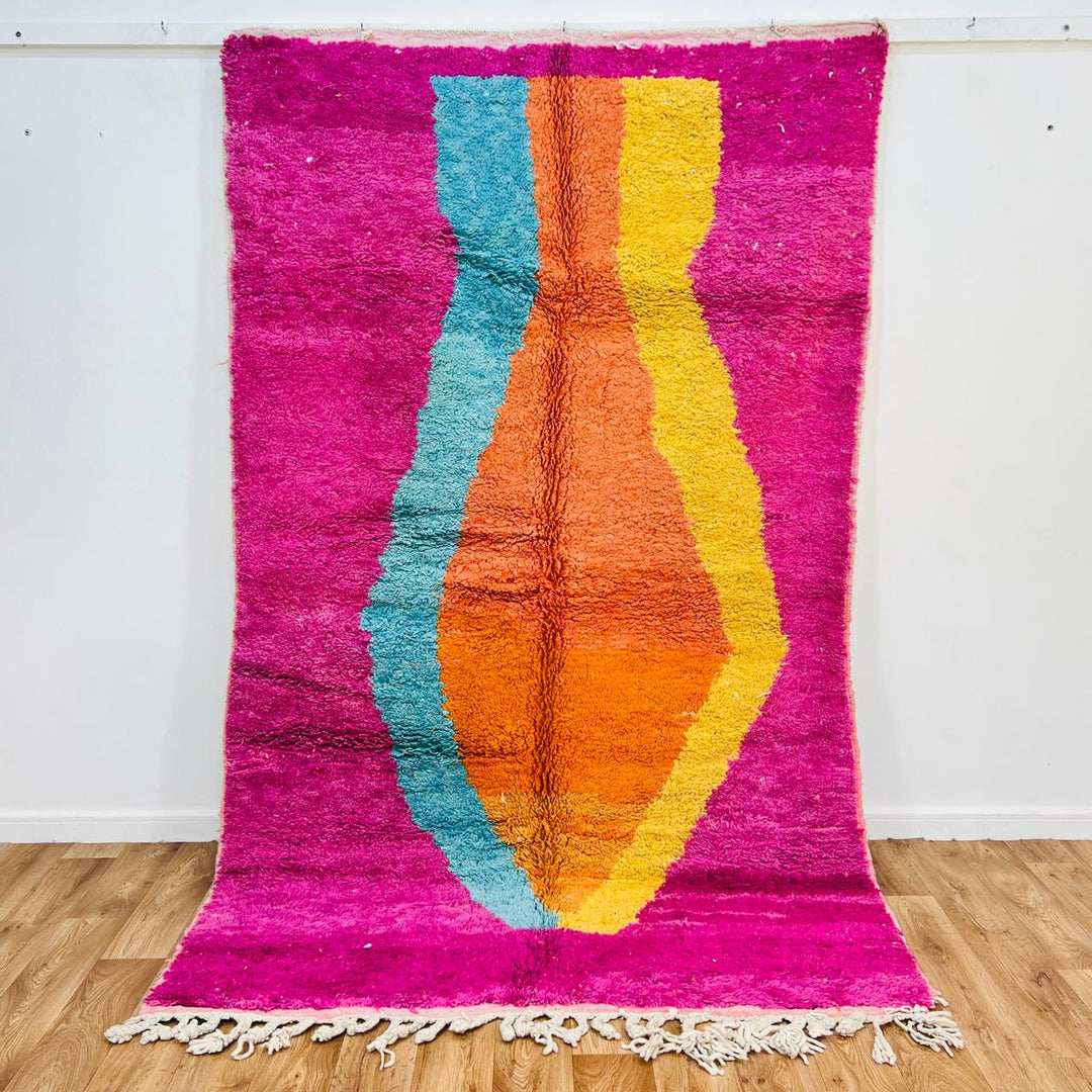Vintage Moroccan wool rug with pink base, turquoise, orange and yellow abstract Berber design, handmade in Morocco, size 255x156 cm