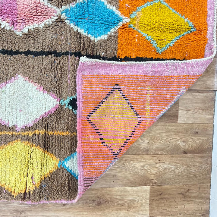 Vintage Moroccan wool rug 251 – handmade colorful geometric Berber rug with orange, turquoise, and yellow diamonds (252 × 150 cm).